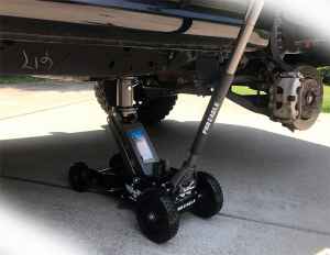 How to use a floor jack to change a tire on your Jeep 