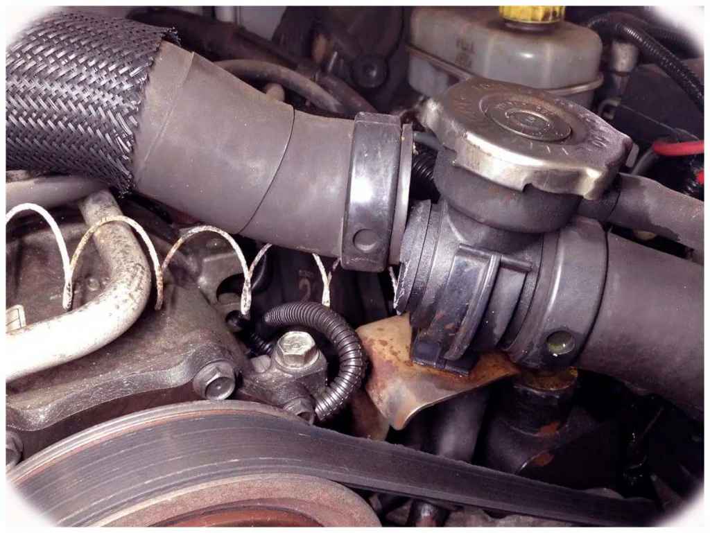 How to Fix a PoppedOff Radiator Hose in a Jeep